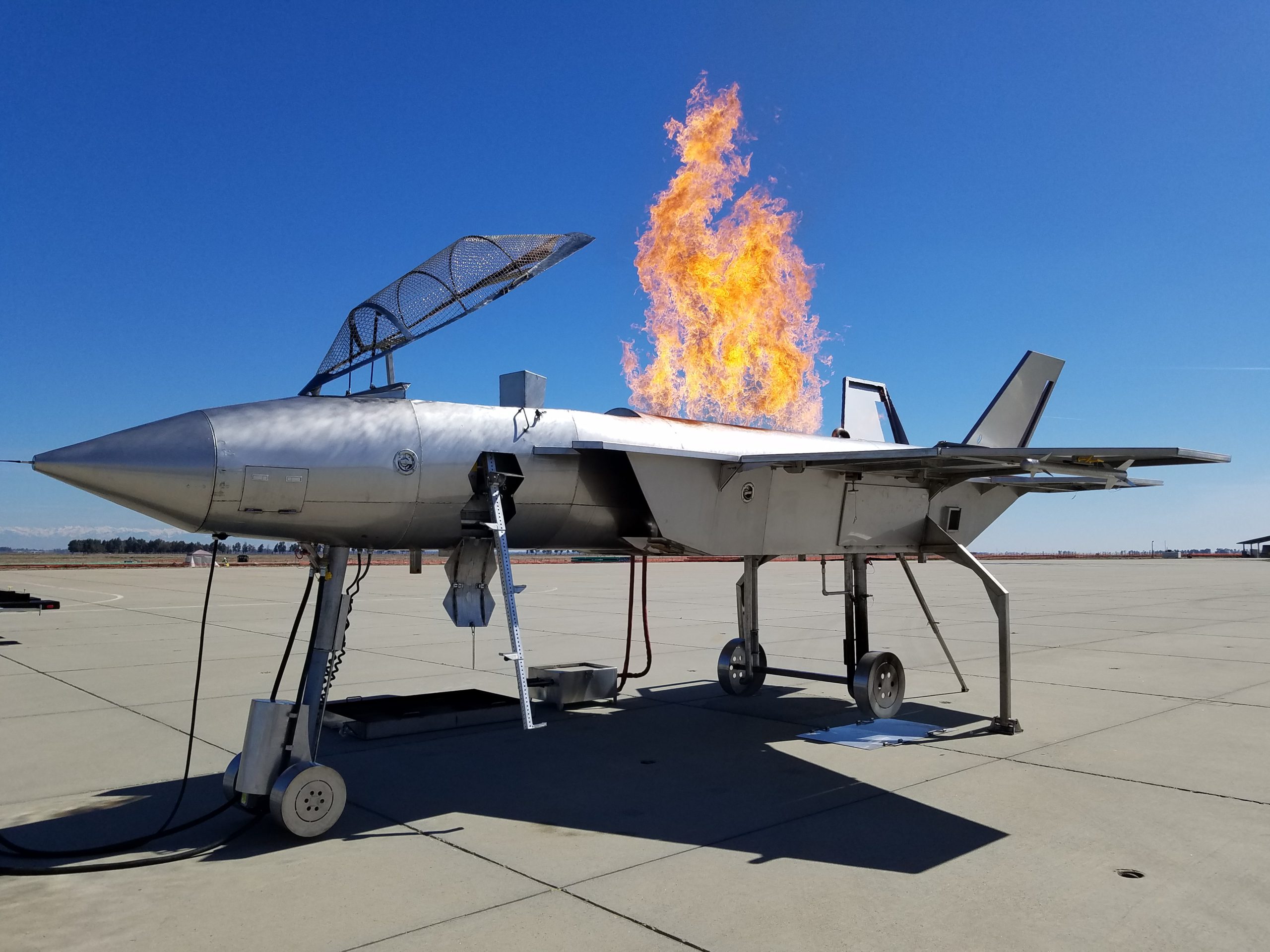Fighter aircraft ARFF training prop with controlled live-fire scenario