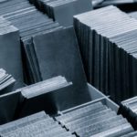 pile of metal sheets with a variety of sizes and shapes. concept of organization and structure industrial concept background