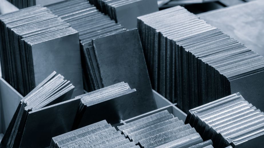 pile of metal sheets with a variety of sizes and shapes. concept of organization and structure industrial concept background