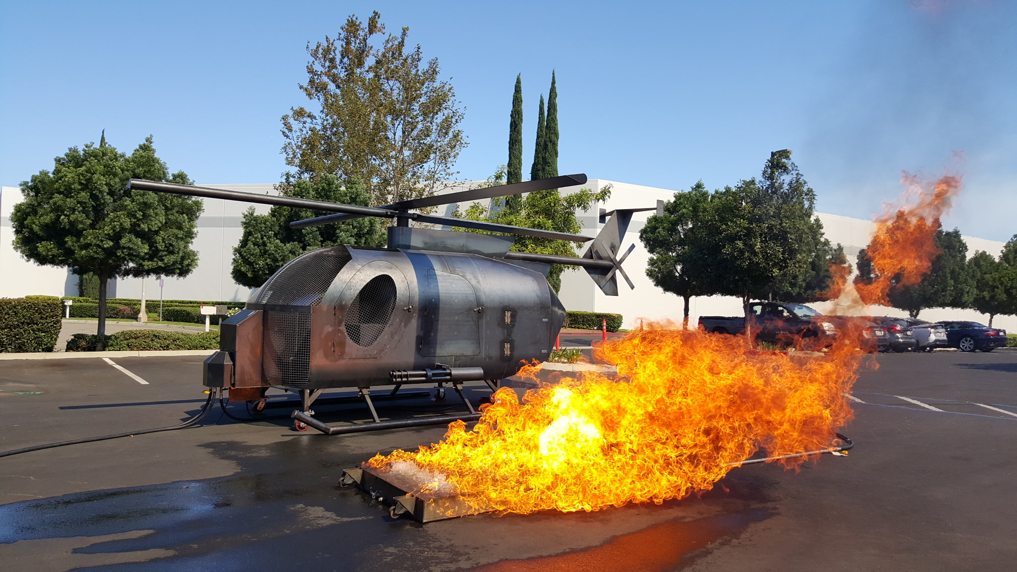 ARFF helicopter live-fire training prop with controlled fuel spill fire