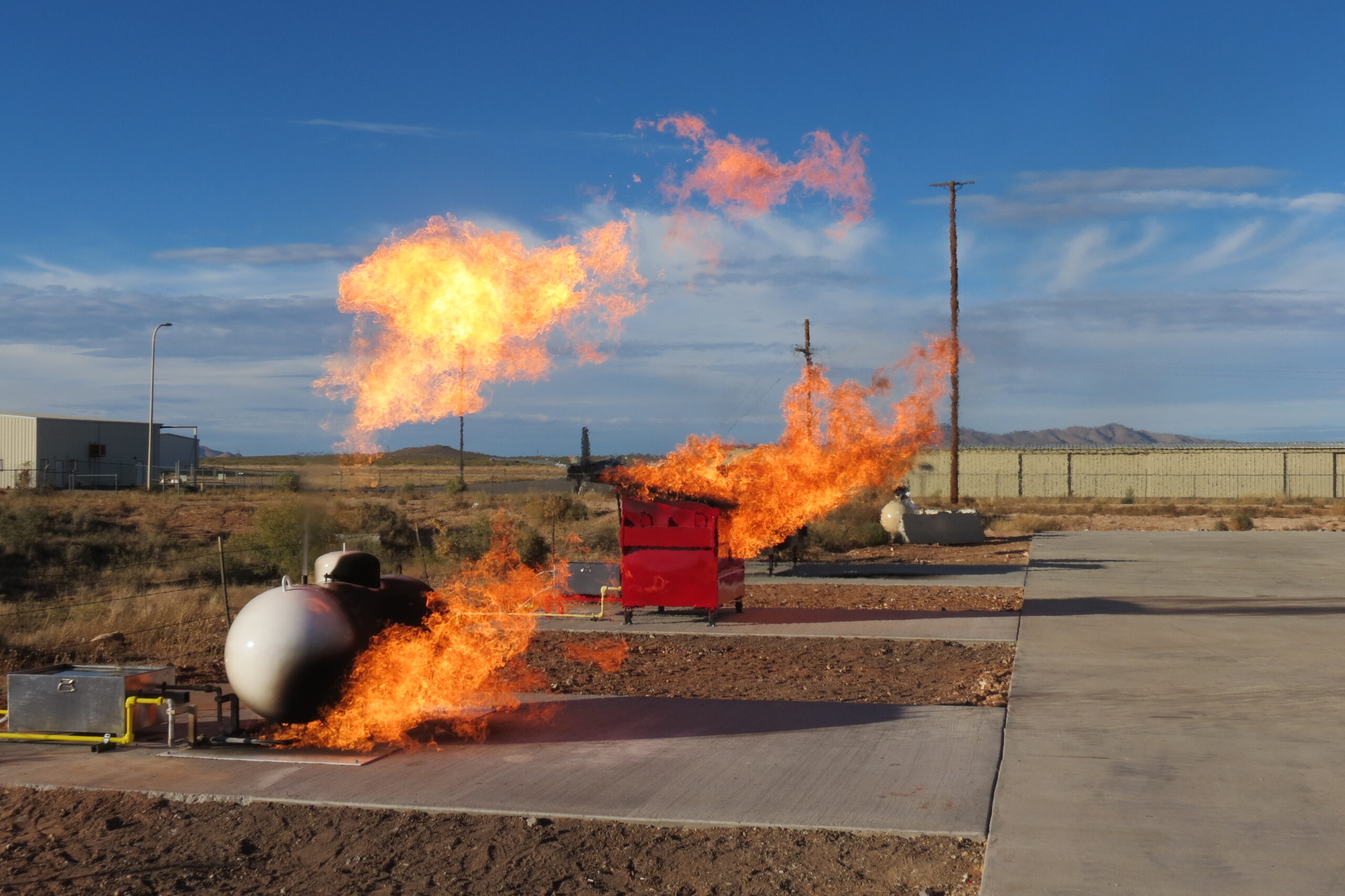 Pressure vessel fire training prop with controlled flames for industrial live-fire firefighter response training